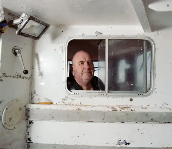 Man looking out of a window.