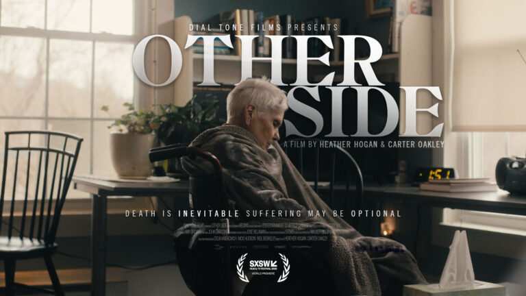 The image is a movie poster for "Other Side," presented by Dial Tone Films. It shows an elderly person with short white hair, wrapped in a blanket and sitting in a wheelchair, looking down thoughtfully. The scene is set in a softly lit room with large windows, books, plants, and a desk in the background. The large title "Other Side" dominates the top, and the tagline below reads: "Death is inevitable. Suffering may be optional." The poster credits Heather Hogan & Carter Oakley as directors and notes the film's world premiere at SXSW.