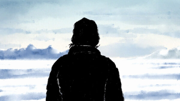 A stylized image shows the silhouette of a person wearing winter clothing, including a hood, standing with their back to the viewer and facing a snowy, ice-covered landscape with distant blue-toned mountains under a pale sky.