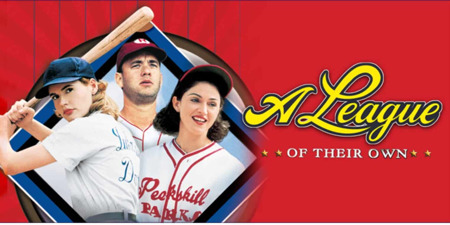 Three baseball players, two women in vintage uniforms and one man in a cap, are shown in front of a red background with the text "A League of Their Own"